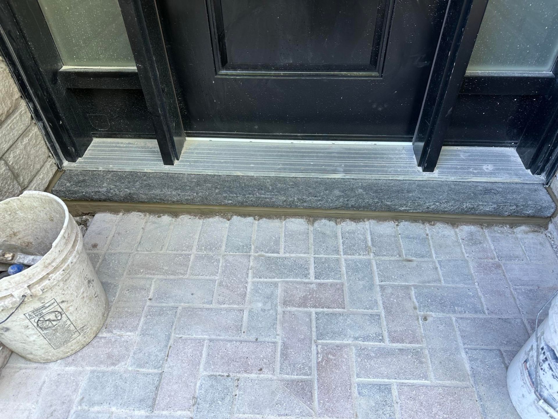 Foundation parging and waterproof granite threshold seal in Vaughan
